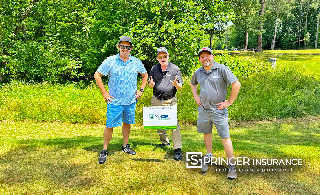 Nick, Chris and Stuart in front of our sponsored tee box