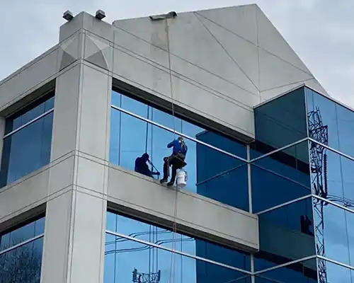 Window Cleaners cleaning the 4th story windows of our Commonwealth Centre office building