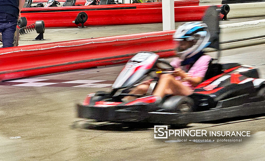 A Go Kart speeds by, probably paid for by saving those installment fees