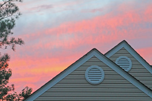 A roof in a red sunset sky